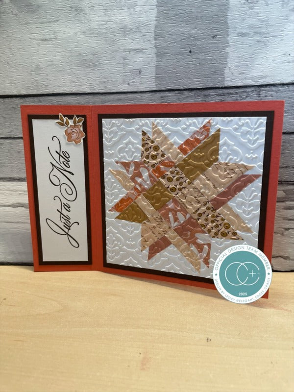 Decorative card with star design and 'Just a Note' text on a textured surface