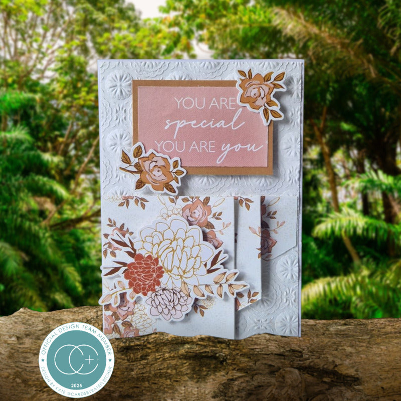 Decorative card with floral designs and motivational text on a natural background
