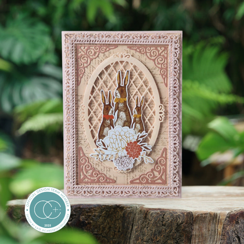 Decorative card with rabbit and floral design on a wooden surface with a natural background