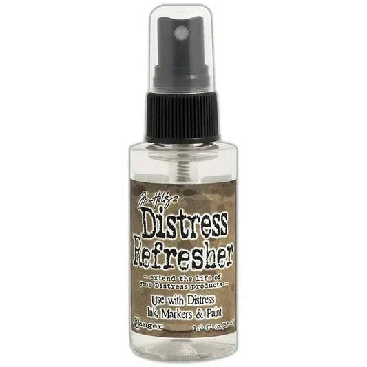 A bottle of Tim Holtz Distress Refresher spray designed for rehydrating and conditioning ink pads, markers, and paint.