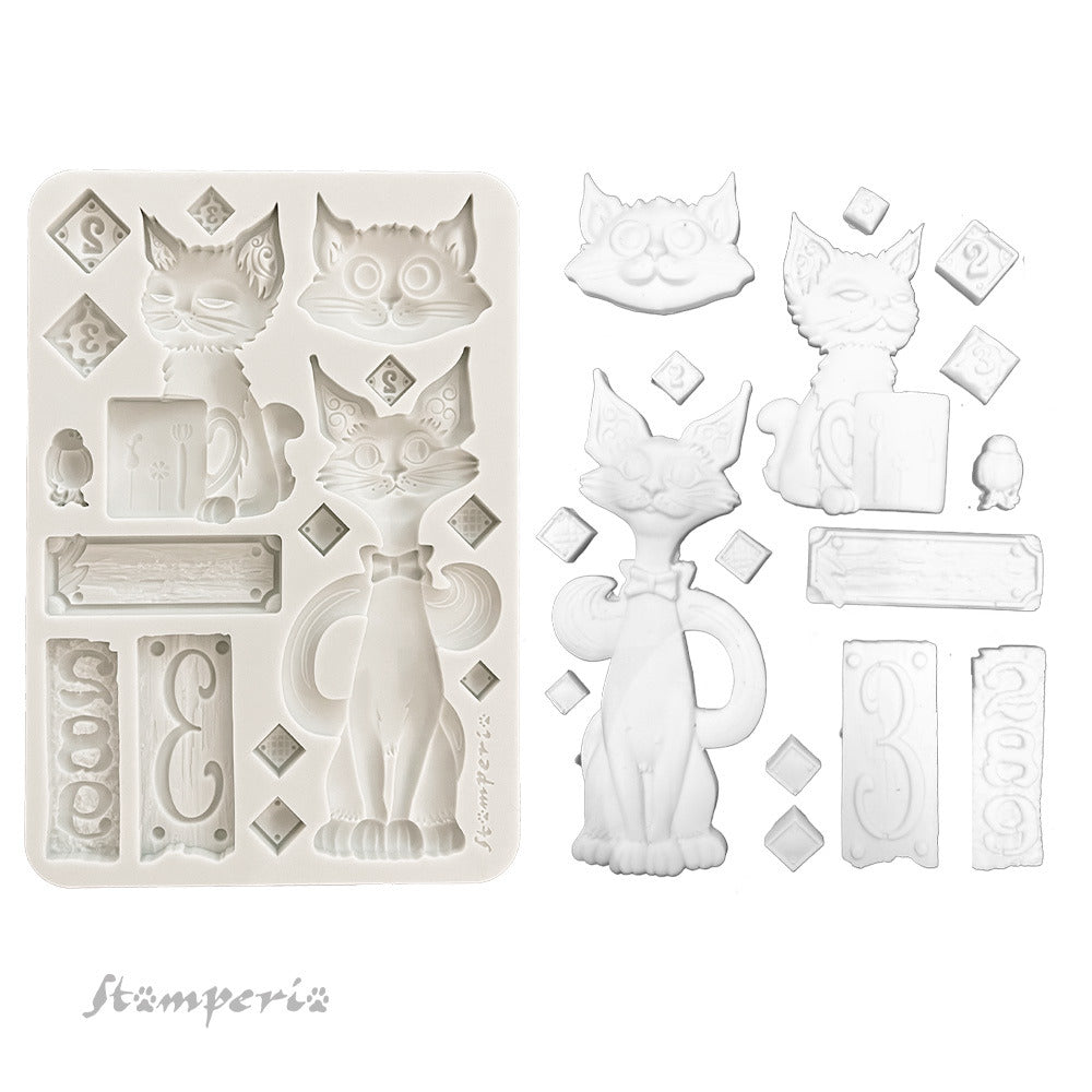 Silicone mold with cat-shaped cavities and additional elements on a white background, featuring the brand 'Stamperia'.