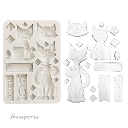 Silicone mold with cat-shaped cavities and additional elements on a white background, featuring the brand 'Stamperia'.