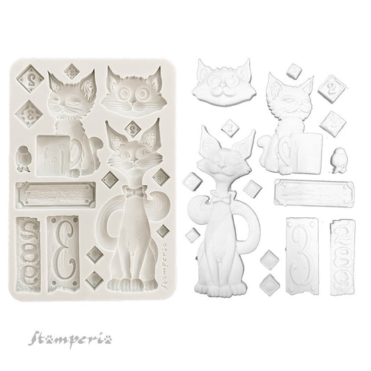 Silicone mold with cat-shaped cavities and additional elements on a white background, featuring the brand 'Stamperia'.