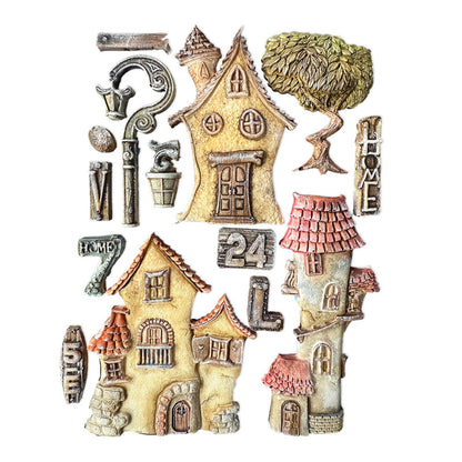 Collection of miniature houses and decorative elements on a white background
