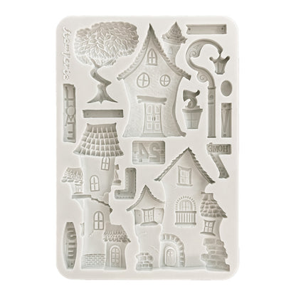 Silicone mold with house-shaped cavities on a white background