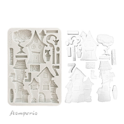 Silicone mold with house-shaped cavities on a white background