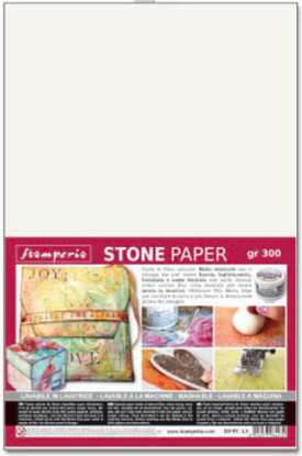 A package of Fiesperis Stone Paper gr 300, featuring a large blank off-white paper sheet on the top and product details, brand logo, and sample images on a red banner at the bottom.