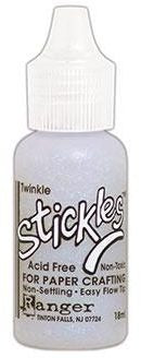A bottle of Stickles Glitter Glue in a fine point applicator tip, labeled 'acid free' and 'for paper crafting', with a white and purple color scheme.