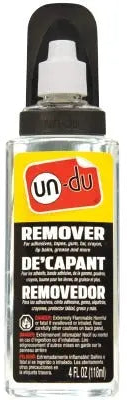 A bottle of Un-Du Adhesive Remover with a spray nozzle, primarily yellow label with black text, white accents, and a black cap.