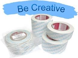 Rolls of white and blue striped tape with the text 'Be Creative' written at the top
