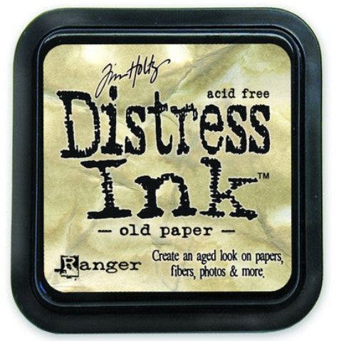 A Distress Ink Pad labeled 'Old Paper' by Tim Holtz, with a black plastic lid and a raised felt surface.