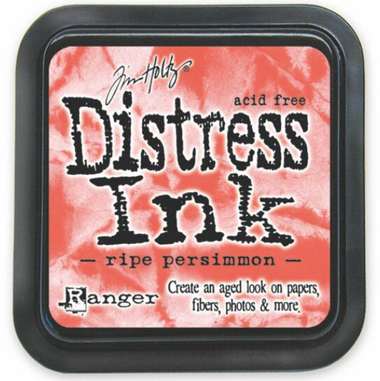 A Distress Ink Pad in a Ripe Persimmon color with a label that includes the product name and the brand name of Ranger.