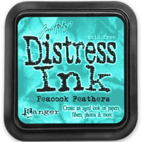 A Distress Ink Pad in Peacock Feathers color by Ranger, designed to create an aged vintage look on various surfaces.