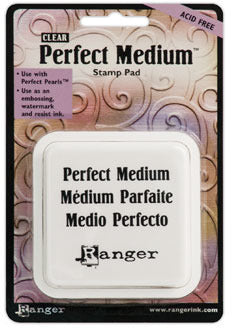 Ranger Clear Perfect Medium acid-free stamp pad in square white packaging on a decorative background