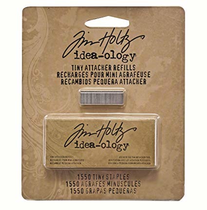 Packaging of Tim Holtz Idea-Ology Tiny Attacher Staple Refill with a clear window showing the staples inside.